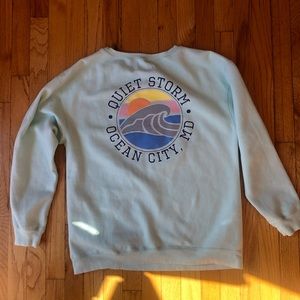 Size medium, lightly used, like new, light cyan, quiet storm surf shop crewneck